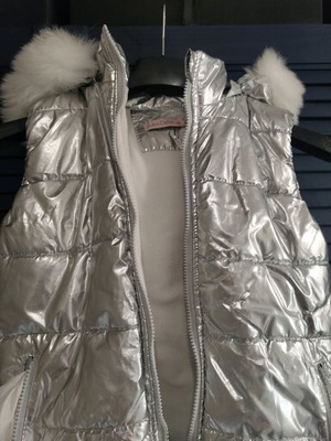 Silver sleeveless jacket used for girls aged 9-11 years