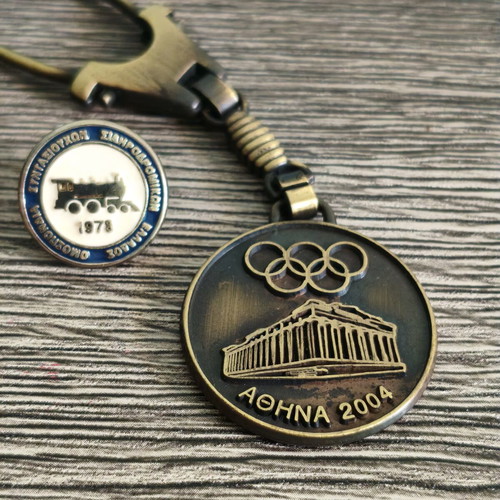 Railway retirees pin and Athens 2004 Olympic keychain set