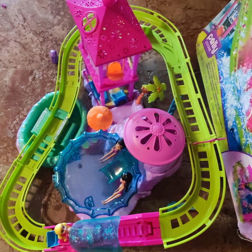 Polly Pocket Spin'n Surprise Waterpark playset used with 3 dolls and accessories