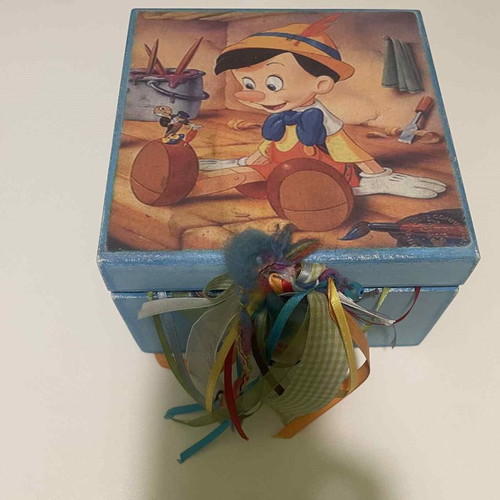 Wooden box with Pinocchio figure used