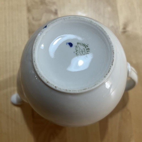 Porcelain tea set used with floral pattern, teapot, creamer, sugar bowl