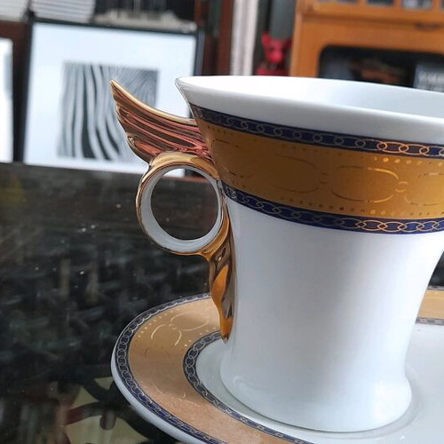 Limoge coffee cup set used, 2 cups with Hermes feather design