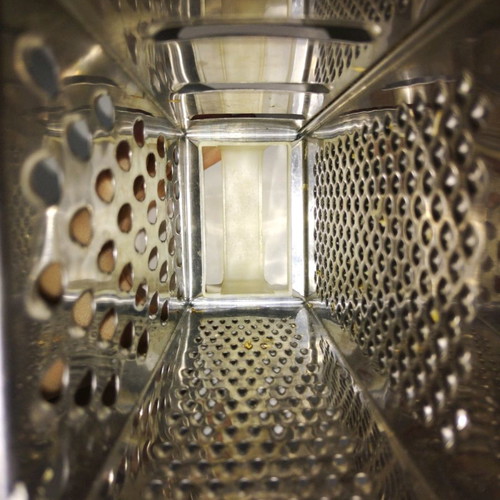 Cheese grater used, stainless steel with plastic handle