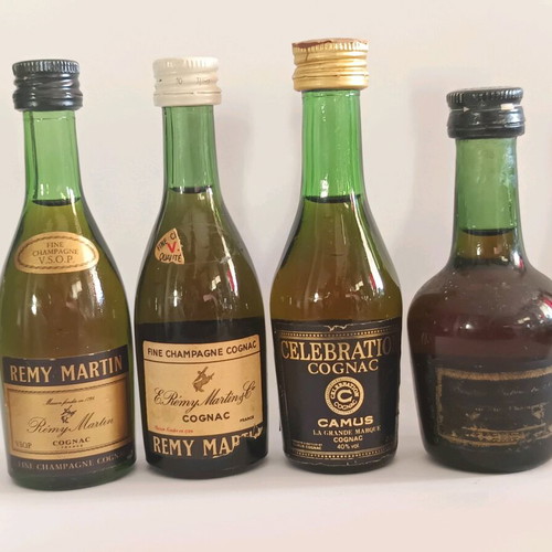 7 miniature cognac bottles, sealed, pack