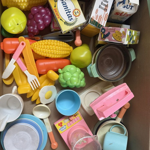 Kitchen playset like new with utensils, food packages, and vegetables