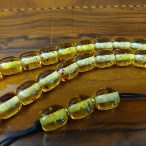 Komboloi made of high-quality resin, new, 33+4 beads amber color