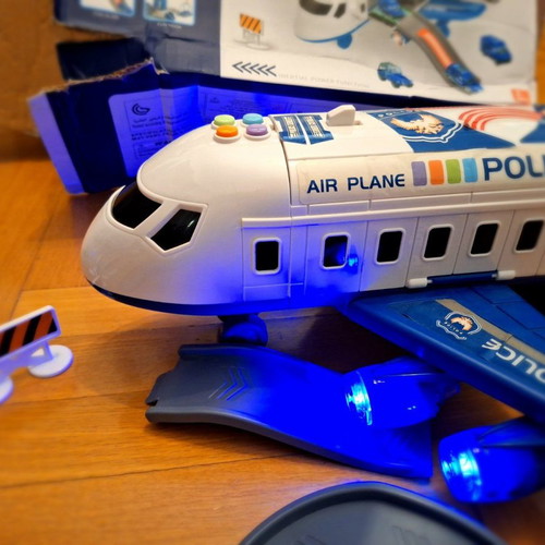 Airplane toy used with lights and sounds, transforms into station