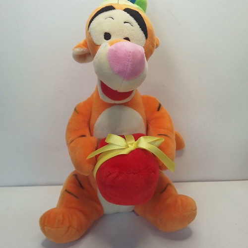 Disney Winnie Tigger plush used with birthday party hat