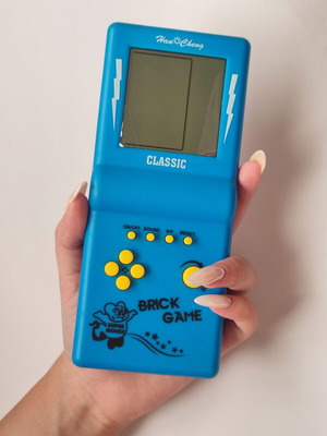 Vintage Tetris handheld game from the 90s, blue, new