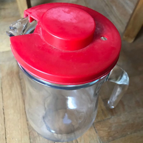 Glass jug with plastic lid used, retro style