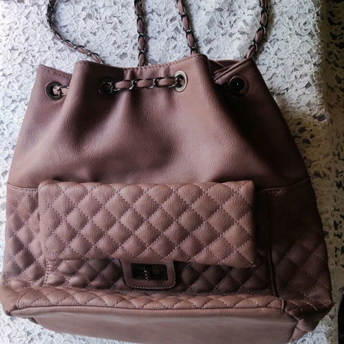Backpack like new with quilted texture and handles