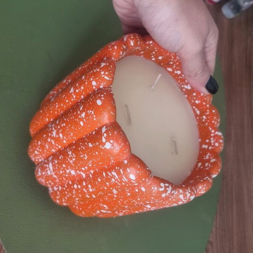 Decorative funky candle like new, bright orange