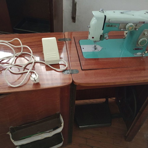 Ideal sewing machine used, foot-powered with motor, wooden cabinet