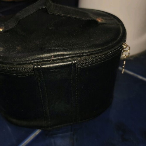 Black toiletry bag like new with zipper and star design