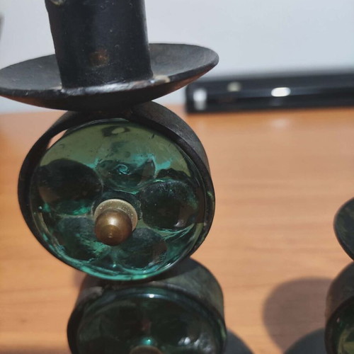 Old candle holders used, metal and glass