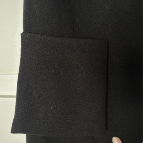 Wool vest black, like new, one size with external pockets