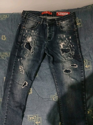 Jeans used, blue with rips, size M
