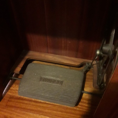 Singer sewing machine refurbished, foot-operated with cabinet