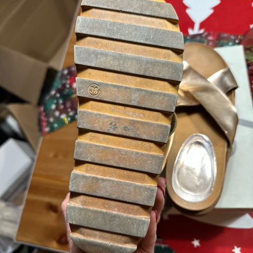 Gold flatforms used with thick treaded sole and wide straps