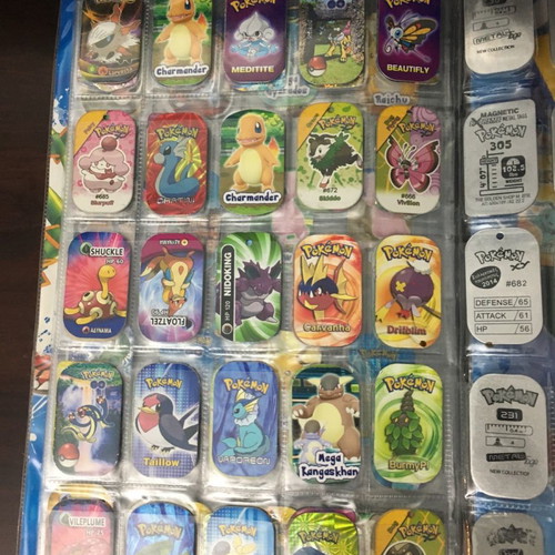 Pokémon album with metal tags used