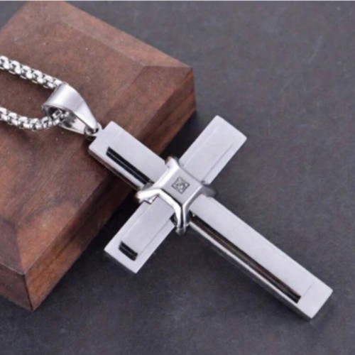 Elegant cross pendant with decorative stone and chain