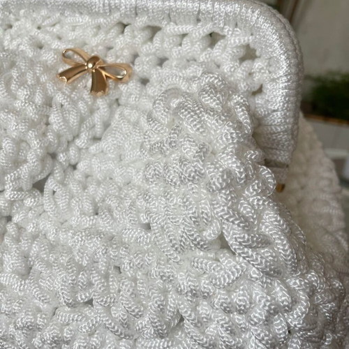 Handmade white shoulder bag with gold bow and clasp