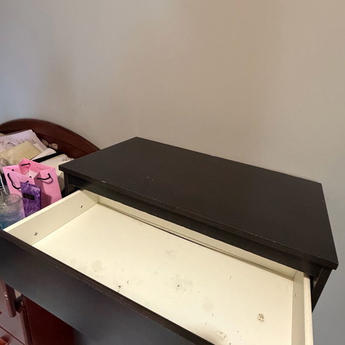 Dark brown wooden chest of drawers used with minimal wear