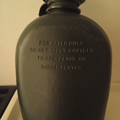 Plastic military canteen with case used