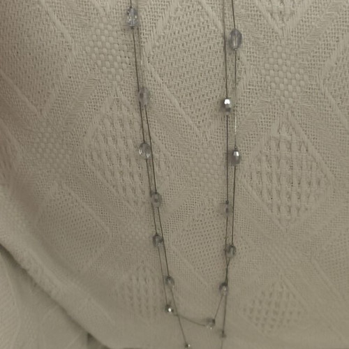 Long necklace used with white and silver beads