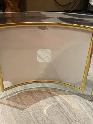 Glass curved photo frame used with gold trim
