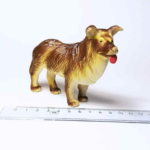 Dog plastic figure used with scratches and marks