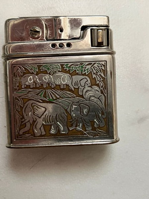 Vintage Rowenda petrol lighter used with embossed elephant motif