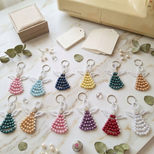 17 Handmade pearl angel keychains in various colors