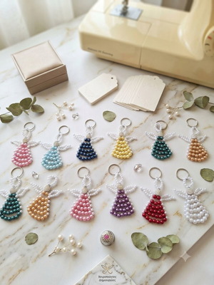 17 Handmade pearl angel keychains in various colors