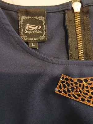 Iso blue blouse with sewn jewelry