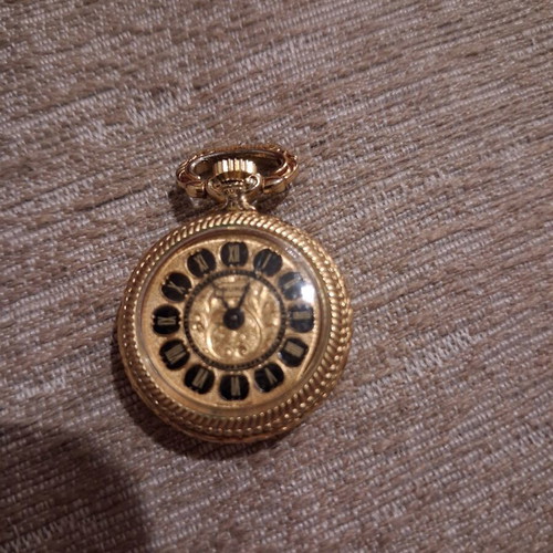 Double-sided pendant watch with Mona Lisa design