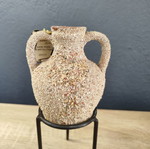 Handmade ceramic amphora decorative vase on metal base used