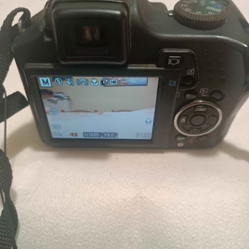 Olympus SP590UZ digital camera used, 26x zoom, retro style