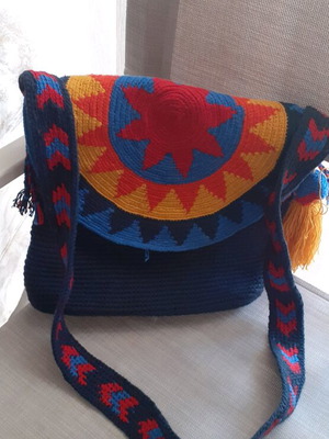 Handmade knitted shoulder bag with boho elements, blue and yellow