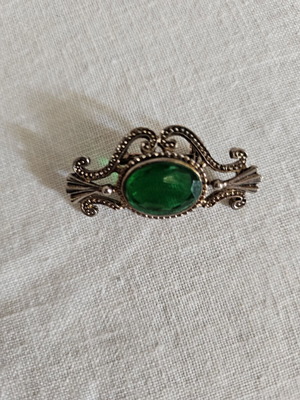 Pin used, green and gold