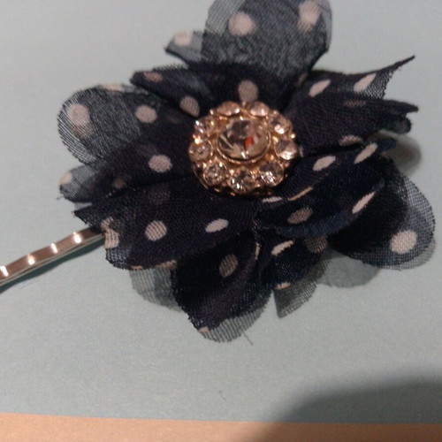 Hair accessory with blue and white flower and rhinestones