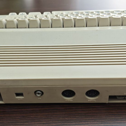 Commodore C64c personal computer with joystick and accessories