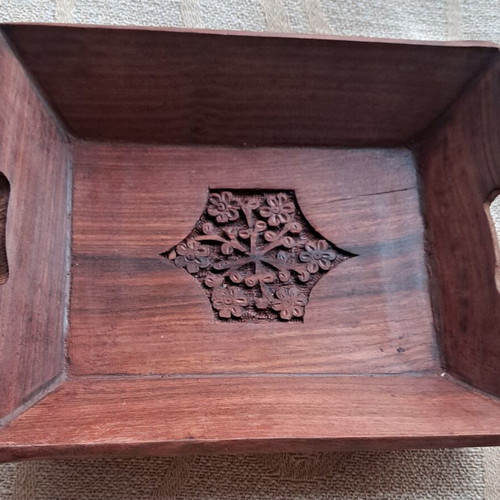 Vintage wooden serving tray used with carved floral motif