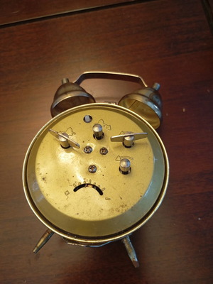 Vintage table clock alarm with natural patina used