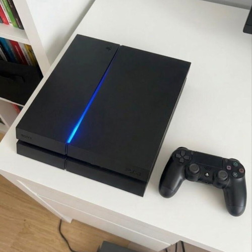 PS4 Fat console with power cable and DualShock 4 controller