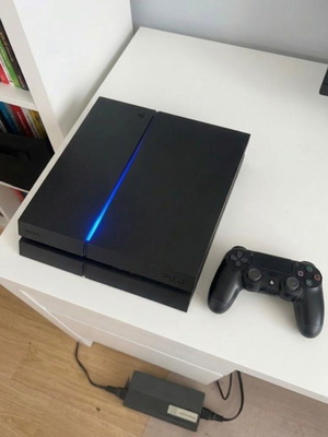 PS4 Fat console with power cable and DualShock 4 controller