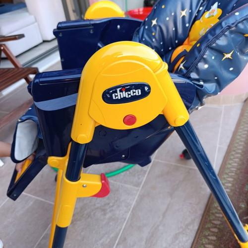 High chair used with plastic tear and stickers