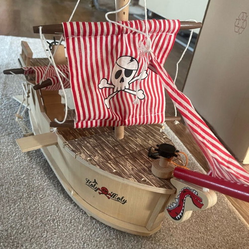 Wooden pirate ship used with small break and marker stains