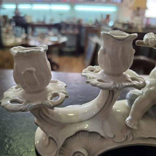 Hutschenreuther Selb porcelain four-light candelabra used, putti design