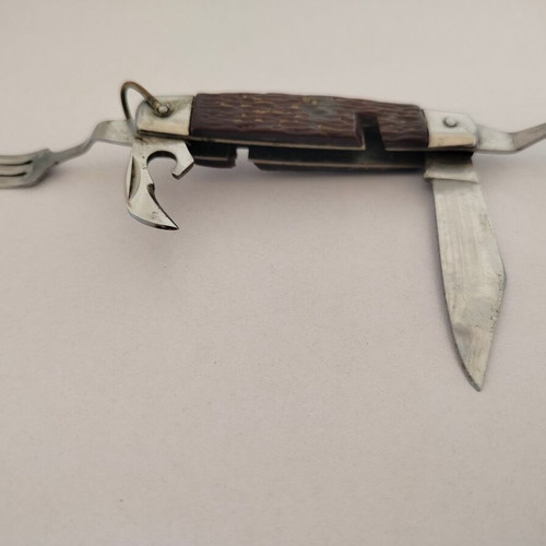 Vintage pocket knife with integrated fork and spoon, used
